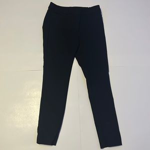 Small pockets in front and back, belt loops.